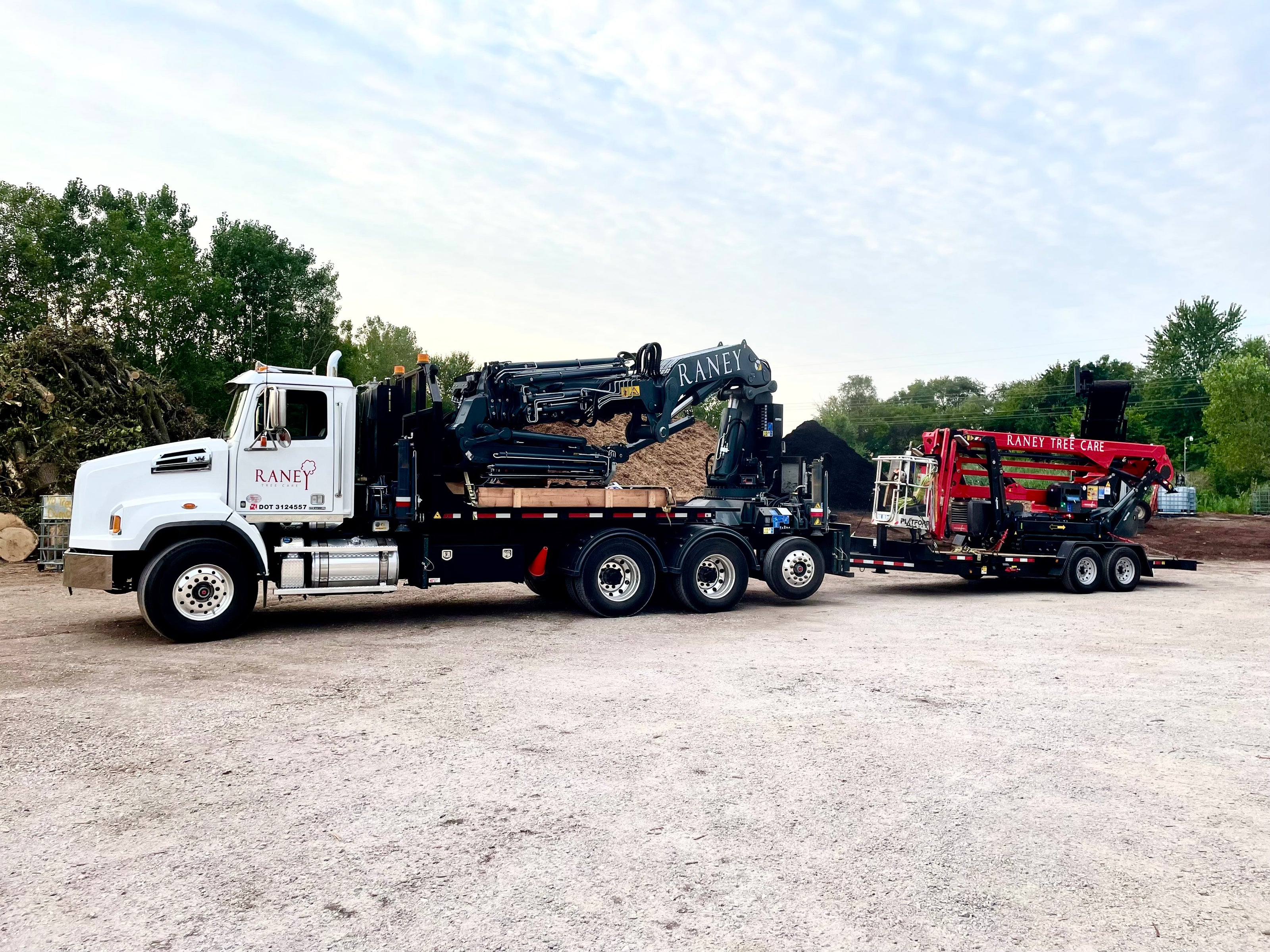 Raney Tree Care Western Star with Copma Crane and Red Track Lift Trailer